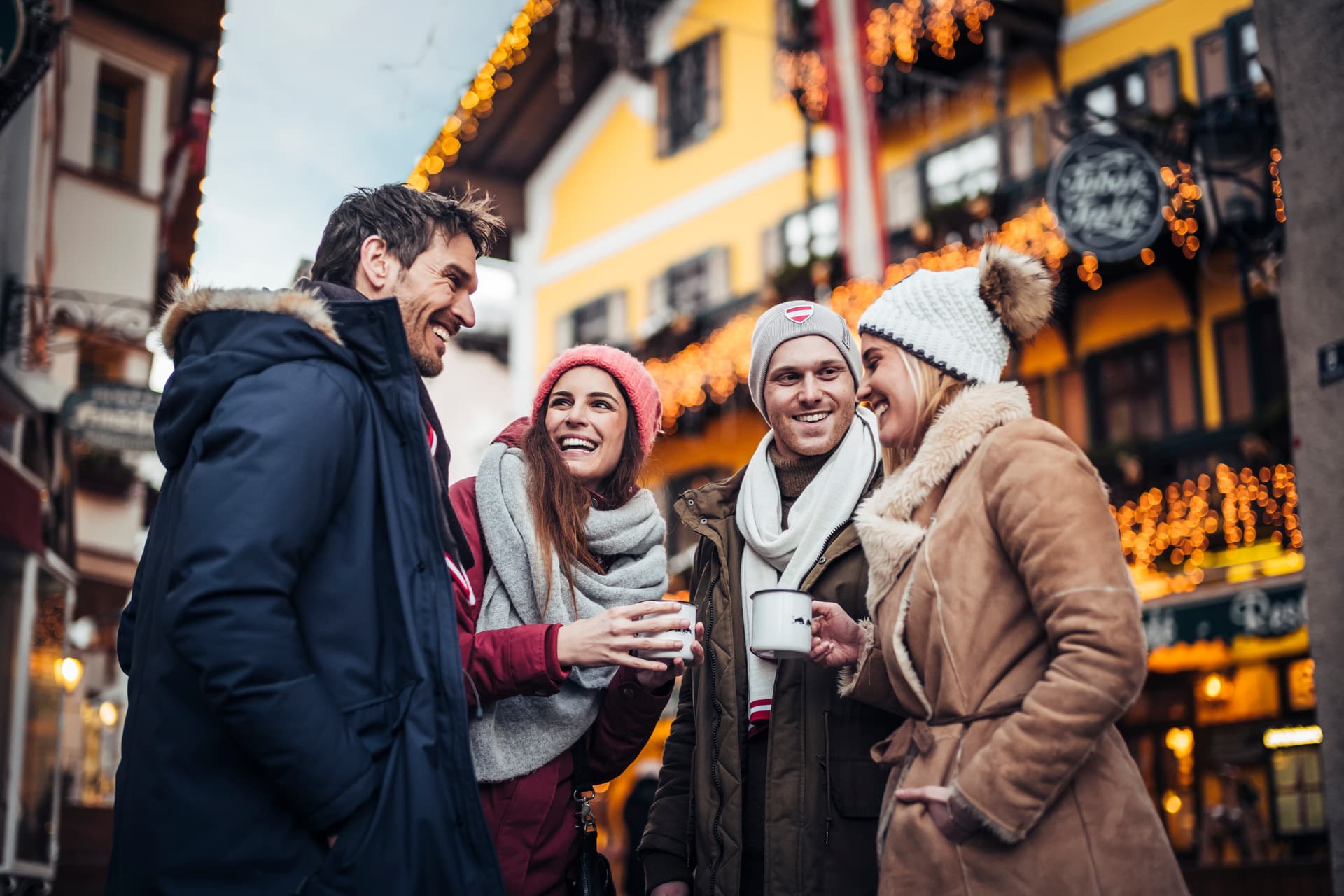 Friends enjoying coffee at Zell Am See winter market
